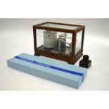 A small glazed oak-cased barograph by J.