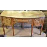 A 19th century mahogany bowfront sideboard server having a frieze drawer flanked by geometric