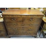 A George III mahogany shell motif inlaid chest of two short over three long graduated drawers with
