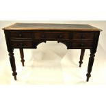 A mid 19th century mahogany leather top writing table with four frieze drawers and raised on turned