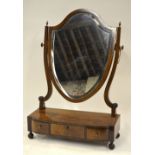 A 19th century flame mahogany platform mirror,