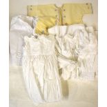 Two boxes of laundered cotton Victorian infant's clothing to include lace edged,