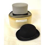 A Christy's London black bowler hat, size 7-1/4 to/w a Moss Bros. grey felt top hat size 7-3/8 (2)