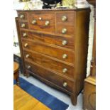 A 19th century flame mahogany North Country chest of five short over four long graduated drawers,