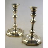 A pair of late Victorian loaded silver candlesticks of octagonal baluster form, in the Carolean