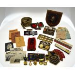 Assorted WWI/II military cap badges to/w a red arm-band initialled PMG (provost Marshall General),