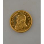 A gold Krugerand coin,