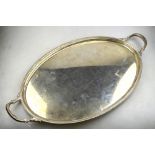 A heavy quality oval silver tray with twin handles and moulded rim, Roberts & Belk Ltd.