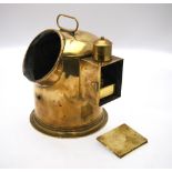 An antique nautical brass binnacle cased gimble framed compass with light box to the side,