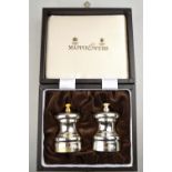 A cased pair of silver salt and pepper mills of baluster form, with Cole & Mason actions,