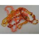 A large collection of vintage necklaces including two rows of stick coral,