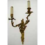 A pair of gilt brass twin-branch wall lights in the rococo manner