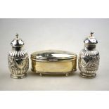 A pair of Victorian silver ovoid pepperettes with foliate-chased decoration, Charles Stuart Harris,