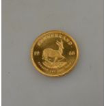 A gold Krugerand coin,