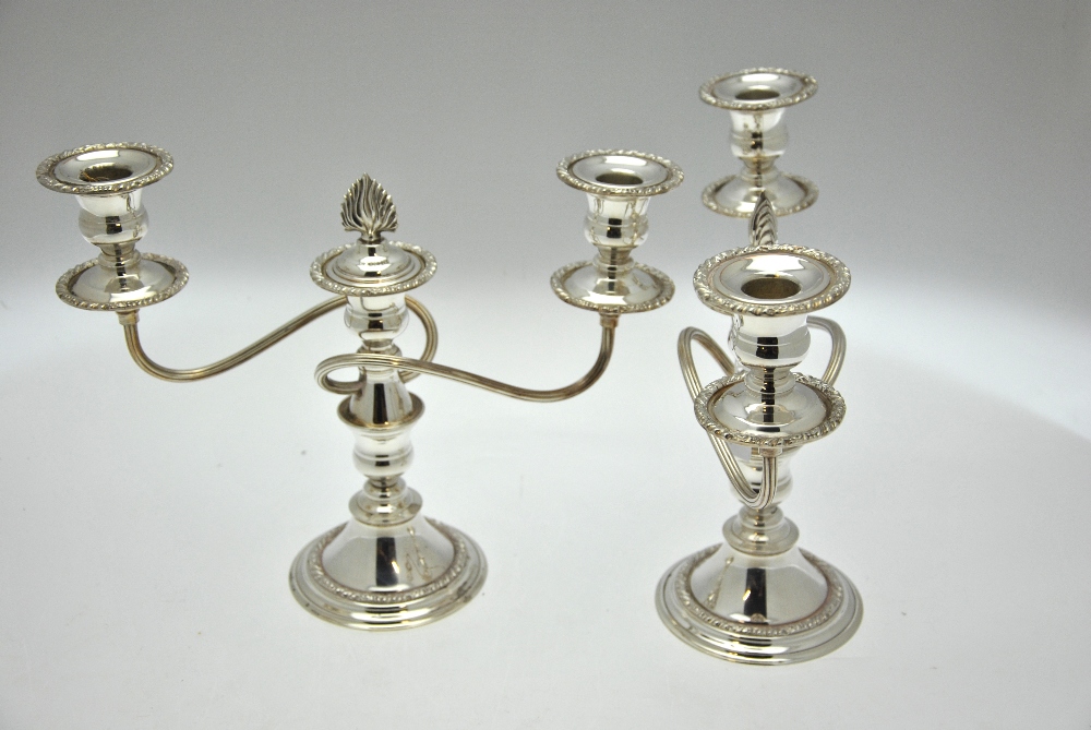 A pair of plated on copper twin-branch candelabra, - Image 2 of 3