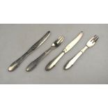 Georg Jensen: two pairs of planished silver dessert knives and forks, bead (kugel) pattern,