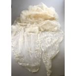 A needle-run wedding veil with attached tulle head-dress set with pearls,