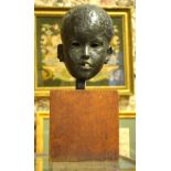 A brown patinated bronze head, portrait of a young child, unsigned, 18 cm high,