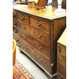 A George III mahogany chest of two short over three long graduated drawers flanked by reeded