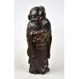 A 19th century Chinese bamboo carving of Lan Ts'ai-Ho, the Daoist immortal carrying a basket of