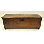 A Commonwealth period oak/elm six plank coffer, the staple hinged top over a part chisel decorated