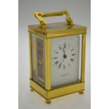 A lacquered brass carriage clock the 8-day drum movement with white dial signed Taylor & Bligh, 15