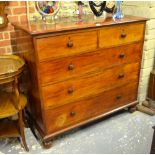 A Victorian mahogany chest of two short over three long graduated drawers retaining original turned