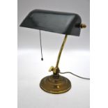 A vintage lacquered brass adjustable arm desk lamp with enamelled shade