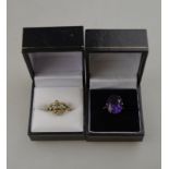 A single stone purple synthetic corundum, yellow metal claw set to/w opal and diamond fleur-de-lys
