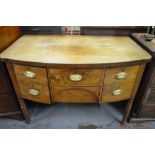 A 19th century mahogany bow-front sideboard having lobed front corners and raised on turned