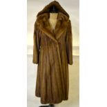 A smoky taupe mink long-length fur coat with revere collar and detachable hood, 50 cm across chest