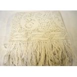 An Edwardian crocheted cotton bedcover with fringing and a knitted heavy cotton bedcover - both for