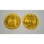 Two Byzantine coins: gold Solidus.