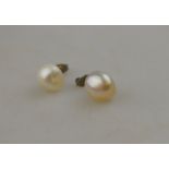 A pair of baroque pearl stud earrings, untested,