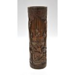A Chinese bamboo brush pot carved with figures in a forest and figures within and beside a building,