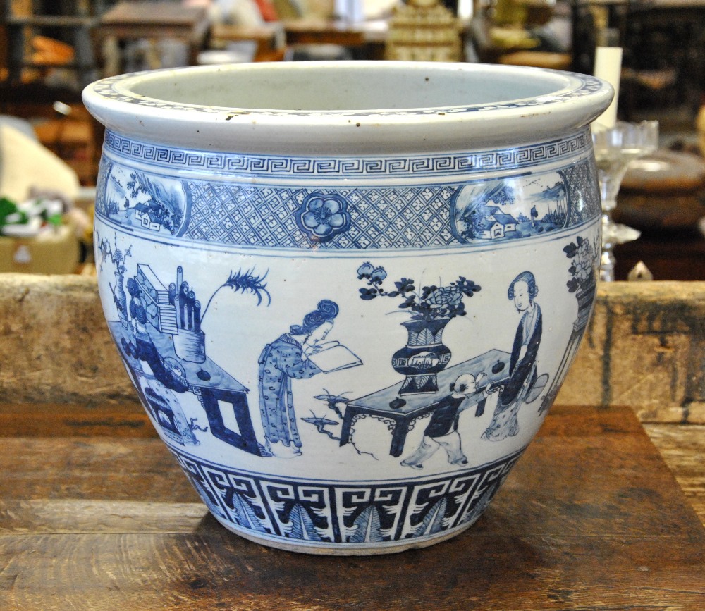 A Chinese blue and white large jardiniere decorated with figures in an interior, late 19th/early