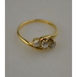 A three stone old cut diamond cluster ring, yellow gold claw set stamped 18ct Condition Report