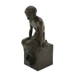 M Pautot - a brown patinated bronze faun, seated on a cube, 20 cm,