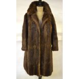 A light brown musquash full-length fur coat retailed by Shattocks, Surbiton, 54 cm across chest