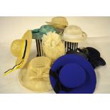 Seven assorted ladies' straw hats and two felt examples contained in a striped hat box Condition