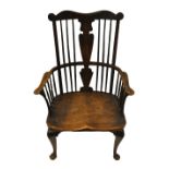 A George III elm seat Windsor armchair, Thames Valley circa 1800, the comb crest over a vase-