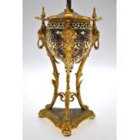 An ornate cast brass desk-stand, to/w a Zsolnay Pecs reticulated pottery and gilt metal lamp-base (