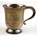 A silver campana-shaped mug with scroll handle and raised foot, Barker Brothers Silver Ltd.,