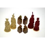 A set of four Chinese ivory chess pieces, kings and queens, one pair stained red,