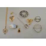 A collection of various silver and gold jewellery items including garnet set pendant,