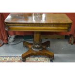 An early Victorian cross-banded figured mahogany tea table,