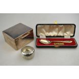 A silver cigarette box, Birmingham 1911, to/w an engraved napkin ring,