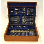 An Edwardian mahogany cased set of electroplated Queen's Pattern flatware for twelve, 75 pcs