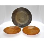 Two terracotta circular plates with slipware decoration, 28 cm diam. to/w a large stoneware bowl