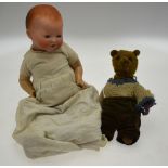 An Armand Marseille 351/4.k. bisque-headed baby doll with closing blue eyes and open mouth with